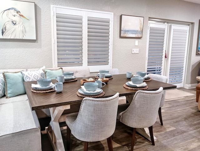 380 Laurie Rd, West Palm Beach, FL 33405 - dining room with a textured wall and wood finished floors