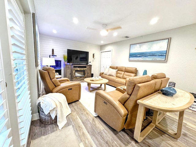 380 Laurie Rd, West Palm Beach, FL 33405 - living room featuring ceiling fan, light wood-type flooring, recessed lighting, and a glass covered fireplace