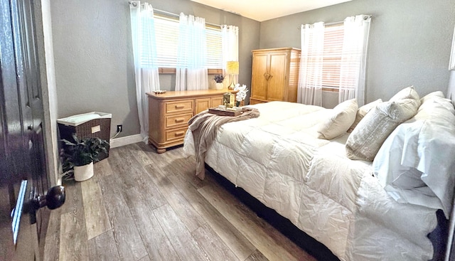 380 Laurie Rd, West Palm Beach, FL 33405 - bedroom with light wood finished floors and baseboards
