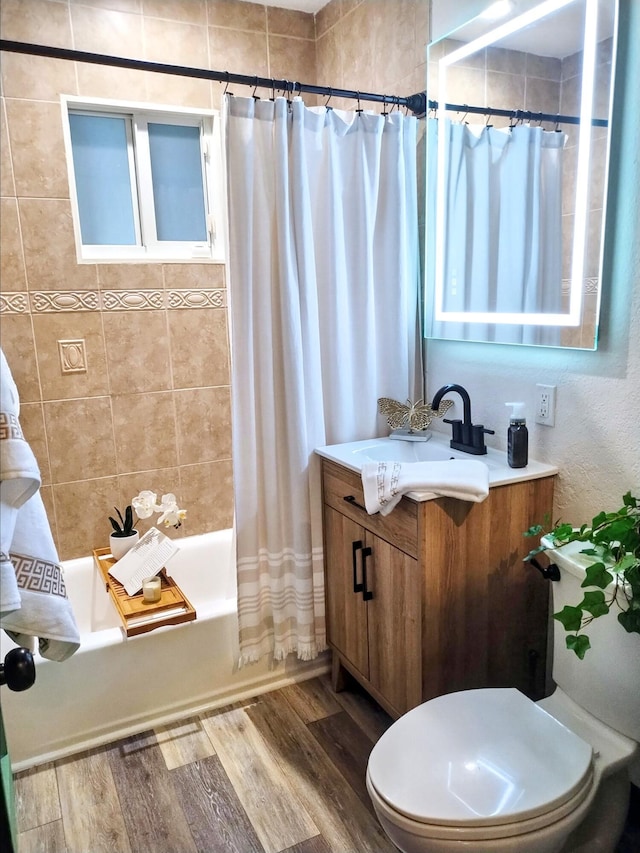 380 Laurie Rd, West Palm Beach, FL 33405 - bathroom with toilet, vanity, shower / tub combo with curtain, and wood finished floors