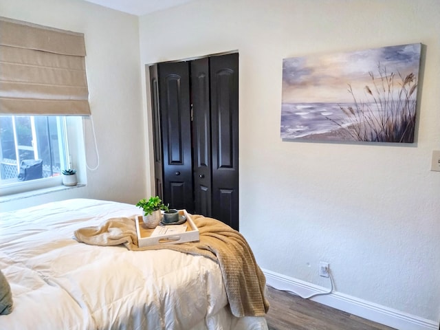 380 Laurie Rd, West Palm Beach, FL 33405 - bedroom featuring baseboards and wood finished floors