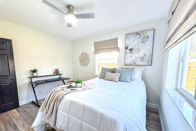 380 Laurie Rd, West Palm Beach, FL 33405 - bedroom featuring wood finished floors, baseboards, and a ceiling fan