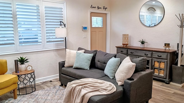 380 Laurie Rd, West Palm Beach, FL 33405 - living room with wood finished floors, baseboards, and a textured wall