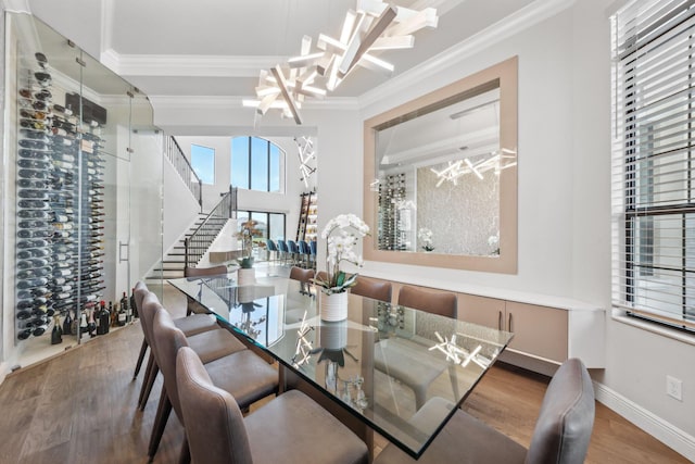 6950 NW 25th Way, Boca Raton, FL 33496 - dining room with ornamental molding, wood finished floors, a chandelier, stairs, and baseboards