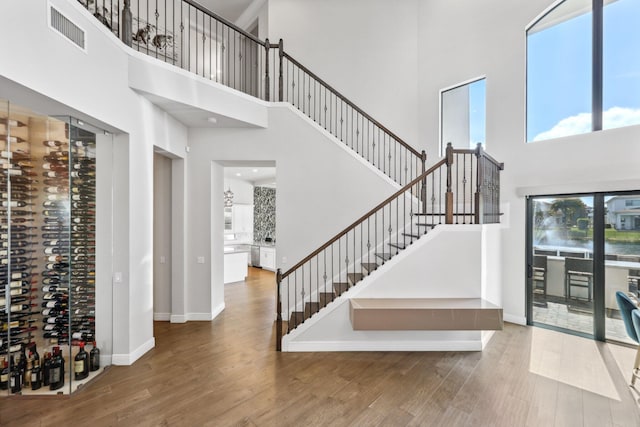 6950 NW 25th Way, Boca Raton, FL 33496 - wine cellar with a high ceiling, wood finished floors, and baseboards