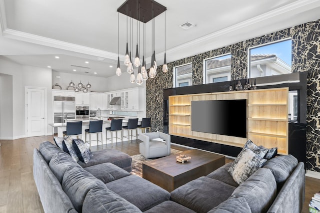 6950 NW 25th Way, Boca Raton, FL 33496 - living room with ornamental molding, recessed lighting, a chandelier, light wood-type flooring, and baseboards