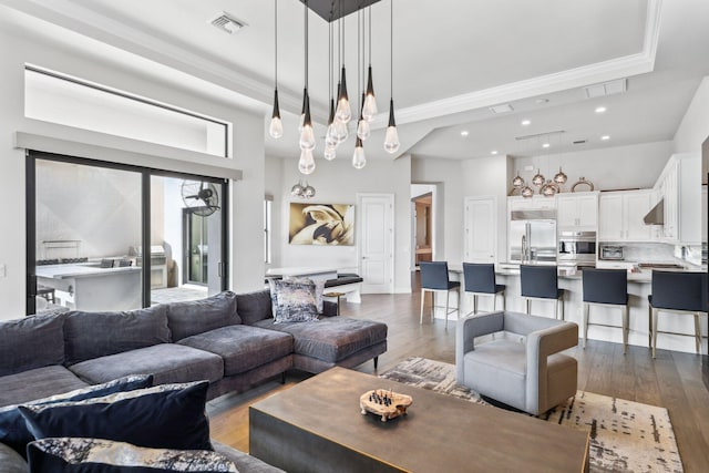6950 NW 25th Way, Boca Raton, FL 33496 - living area with dark wood-style floors, ornamental molding, and recessed lighting