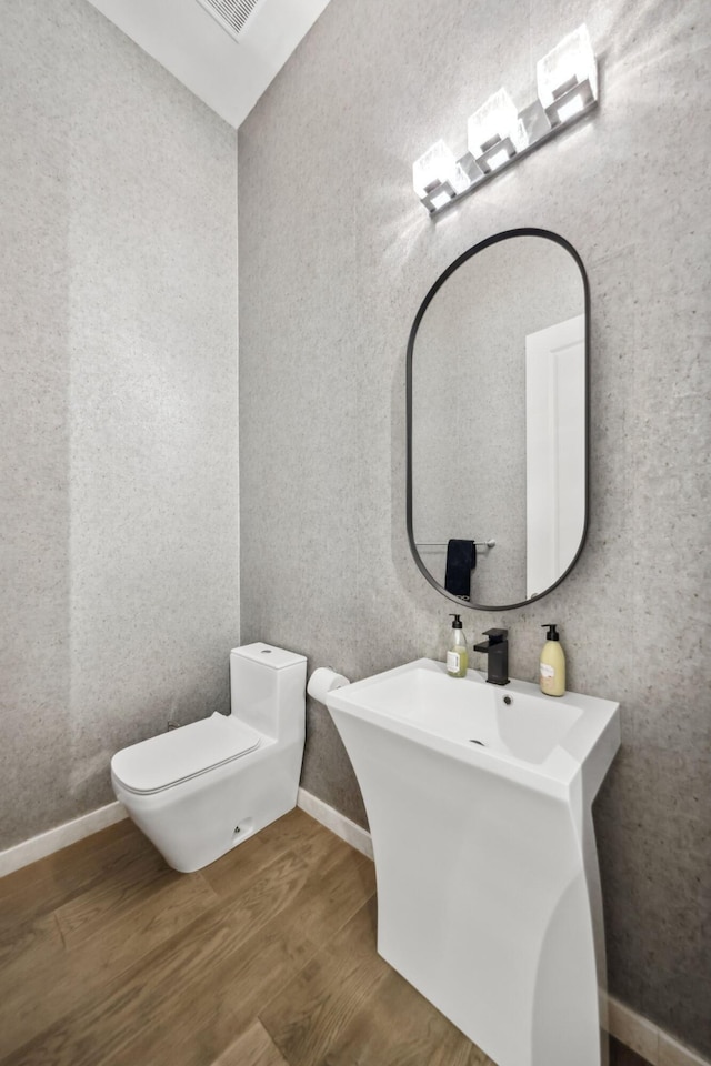 6950 NW 25th Way, Boca Raton, FL 33496 - bathroom featuring wood finished floors and toilet