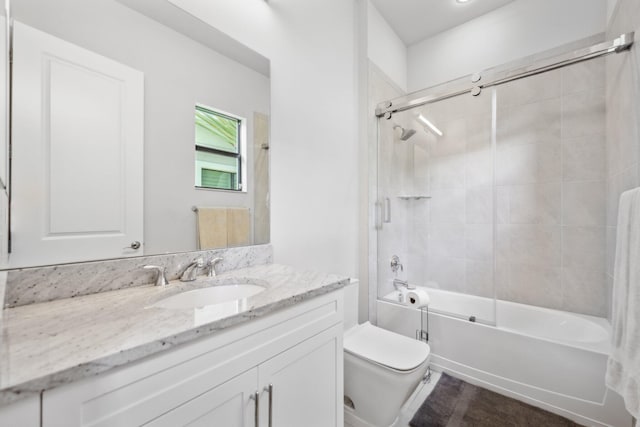 6950 NW 25th Way, Boca Raton, FL 33496 - full bathroom with toilet, bath / shower combo with glass door, and vanity