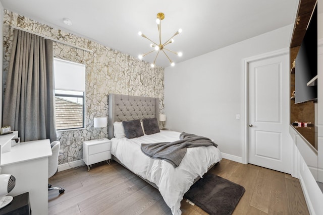 6950 NW 25th Way, Boca Raton, FL 33496 - bedroom featuring a chandelier, wood finished floors, and baseboards