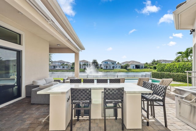 6950 NW 25th Way, Boca Raton, FL 33496 - view of patio / terrace with a water view, a residential view, and fence