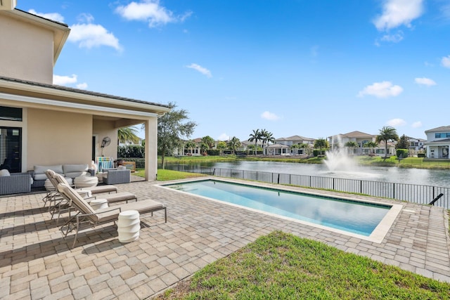 6950 NW 25th Way, Boca Raton, FL 33496 - view of swimming pool with an outdoor living space, a water view, a patio area, and a residential view