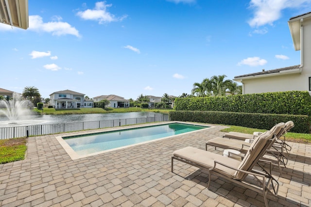 6950 NW 25th Way, Boca Raton, FL 33496 - view of pool with a water view, a patio, a fenced backyard, and a residential view