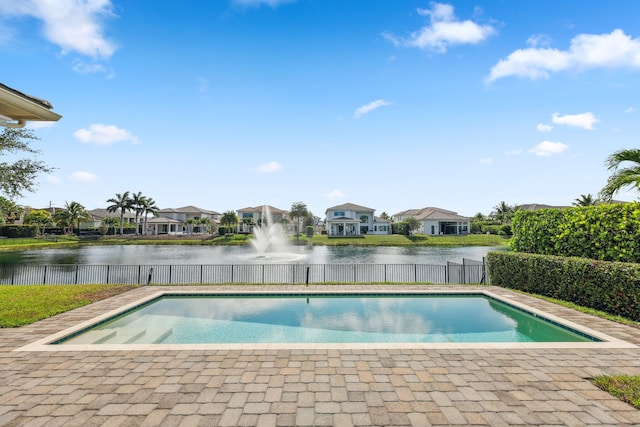 6950 NW 25th Way, Boca Raton, FL 33496 - view of swimming pool with a residential view, a water view, and fence