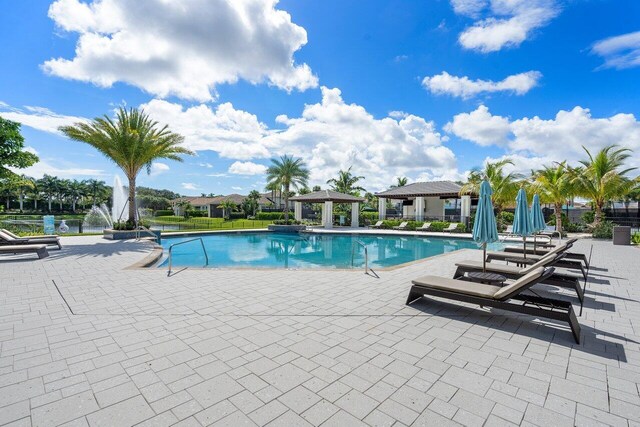6950 NW 25th Way, Boca Raton, FL 33496 - community pool featuring a gazebo and a patio