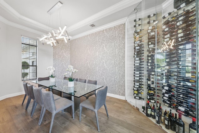 6950 NW 25th Way, Boca Raton, FL 33496 - dining area with crown molding, wood finished floors, a chandelier, baseboards, and wallpapered walls