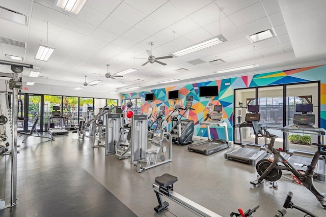 6950 NW 25th Way, Boca Raton, FL 33496 - workout area with ceiling fan, healthy amount of natural light, and a paneled ceiling