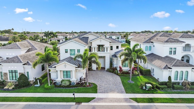 6950 NW 25th Way, Boca Raton, FL 33496 - view of front of house with a residential view, decorative driveway, a tiled roof, and stucco siding