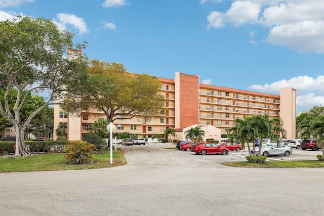 view of property with uncovered parking