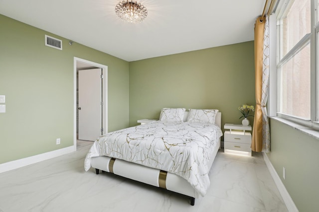 bedroom with visible vents, marble finish floor, baseboards, and a notable chandelier
