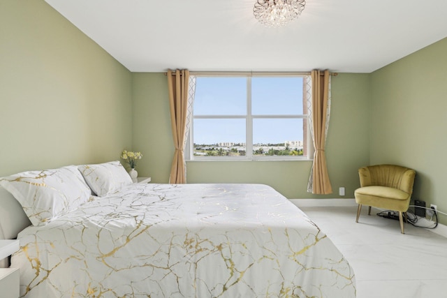 bedroom with baseboards and marble finish floor