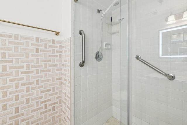 full bathroom with a stall shower