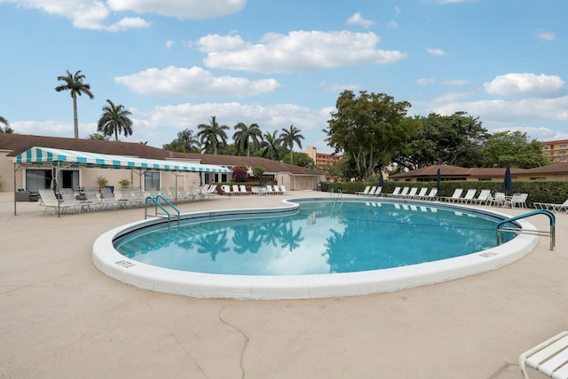 community pool featuring a patio area