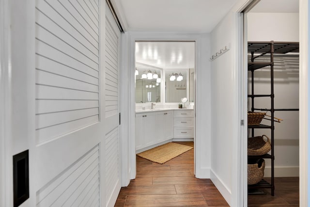 interior space with baseboards and dark wood-style flooring