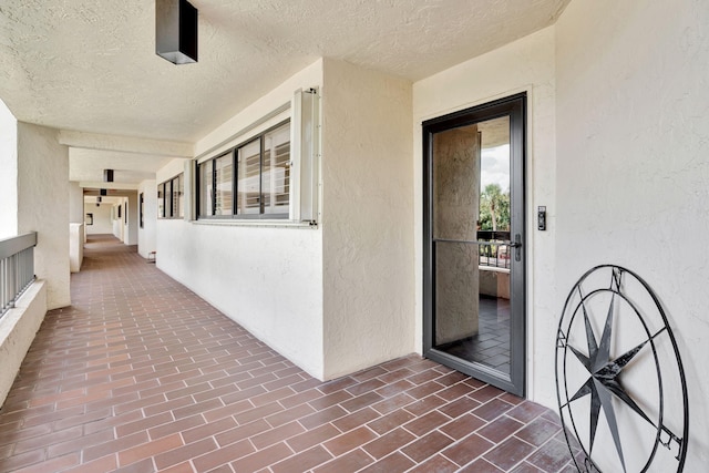 doorway to property with stucco siding