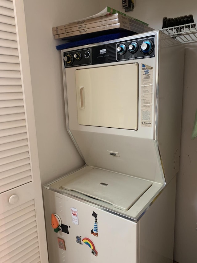 laundry room with laundry area and stacked washer / drying machine