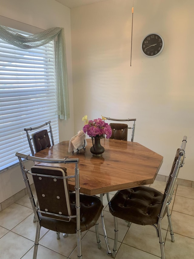 dining area featuring light tile patterned flooring
