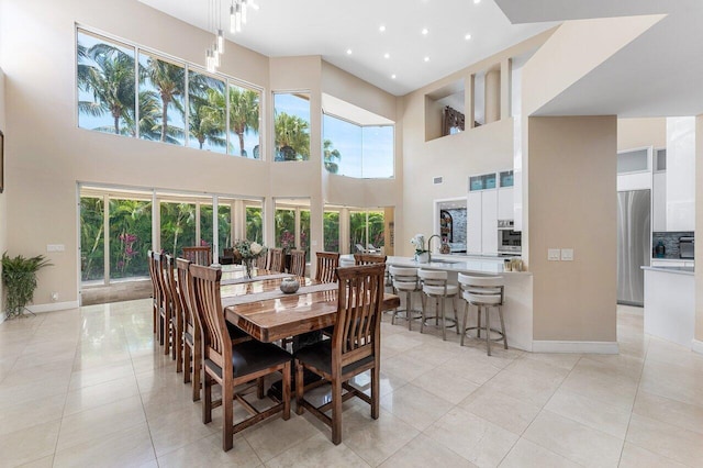 17906 Aberdeen Way, Boca Raton, FL 33496 - dining area with a towering ceiling, light tile patterned floors, baseboards, and recessed lighting