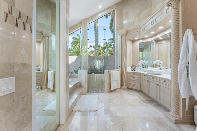 17906 Aberdeen Way, Boca Raton, FL 33496 - full bath featuring ornate columns, tile walls, vanity, recessed lighting, and marble tiled floors