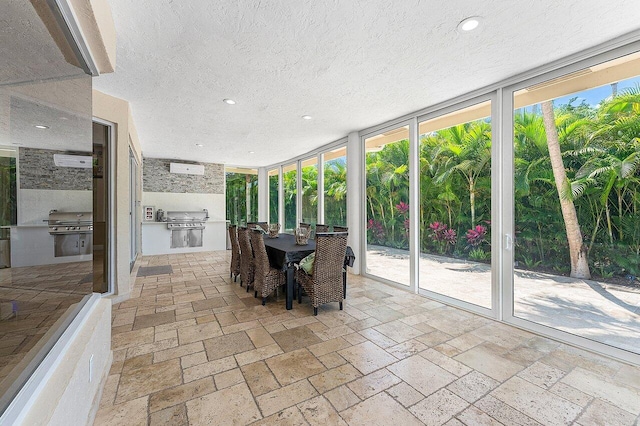 17906 Aberdeen Way, Boca Raton, FL 33496 - sunroom with a textured ceiling, recessed lighting, expansive windows, and stone tile flooring