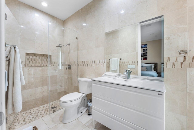 17906 Aberdeen Way, Boca Raton, FL 33496 - ensuite bathroom featuring tile walls, walk in shower, tile patterned flooring, toilet, and vanity