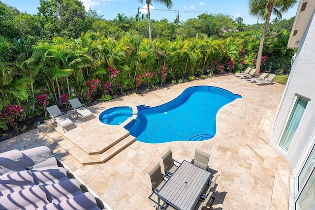 17906 Aberdeen Way, Boca Raton, FL 33496 - view of pool featuring a patio area, a pool with connected hot tub, and view of scattered trees
