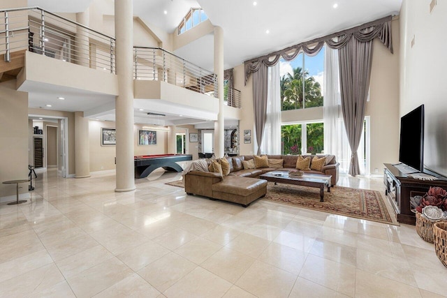 17906 Aberdeen Way, Boca Raton, FL 33496 - living area with a towering ceiling, decorative columns, billiards, baseboards, and light tile patterned flooring