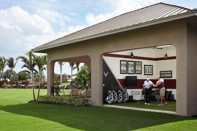17906 Aberdeen Way, Boca Raton, FL 33496 - exterior space with a standing seam roof, metal roof, stucco siding, and a lawn