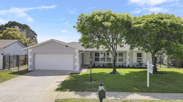 2732 Starwood Cir, West Palm Beach, FL 33406 - ranch-style house featuring an attached garage and driveway