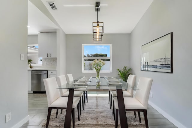 2732 Starwood Cir, West Palm Beach, FL 33406 - dining space featuring baseboards and wood finished floors