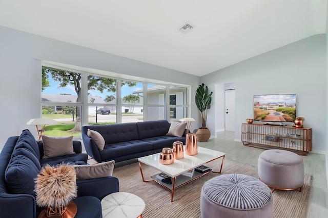 2732 Starwood Cir, West Palm Beach, FL 33406 - living room featuring lofted ceiling, wood finished floors, and baseboards