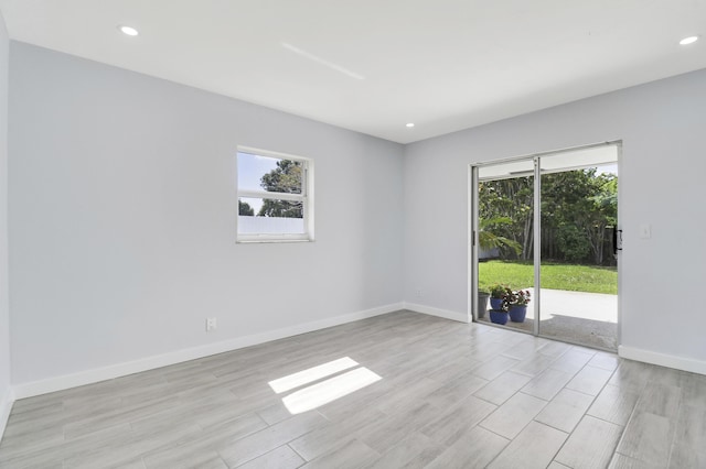 2732 Starwood Cir, West Palm Beach, FL 33406 - unfurnished room featuring plenty of natural light, light wood-style flooring, recessed lighting, and baseboards