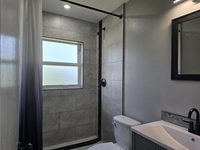 2732 Starwood Cir, West Palm Beach, FL 33406 - bathroom with tiled shower, toilet, and vanity