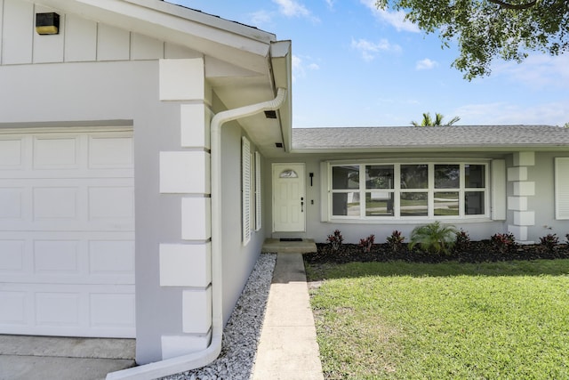 2732 Starwood Cir, West Palm Beach, FL 33406 - entrance to property with a yard, a garage, and a shingled roof