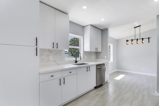2732 Starwood Cir, West Palm Beach, FL 33406 - kitchen featuring a sink, stainless steel dishwasher, decorative backsplash, light countertops, and white cabinets