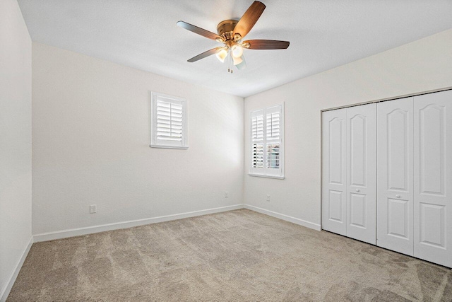 12949 Anthorne Ln, Boynton Beach, FL 33436 - unfurnished bedroom with baseboards, a ceiling fan, carpet, and a closet