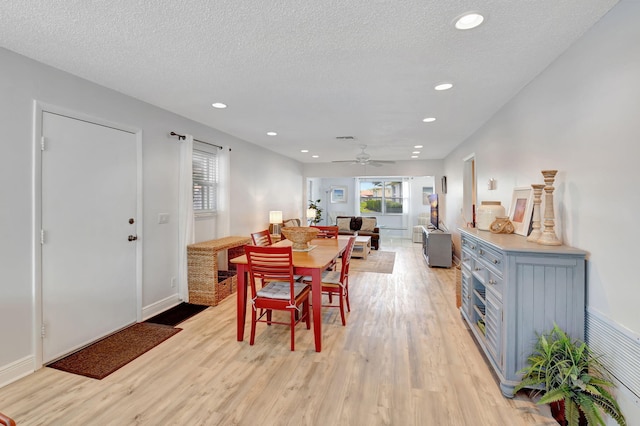 124 Mockingbird Ln Unit 124, Delray Beach, FL 33445 - dining area with light wood-style floors, baseboards, recessed lighting, ceiling fan, and a textured ceiling