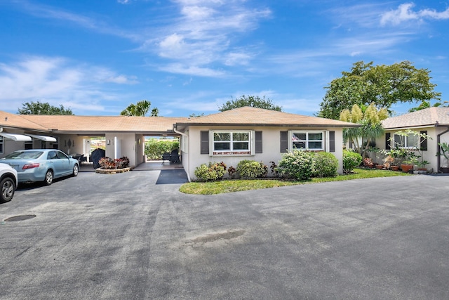 124 Mockingbird Ln Unit 124, Delray Beach, FL 33445 - single story home with stucco siding and driveway