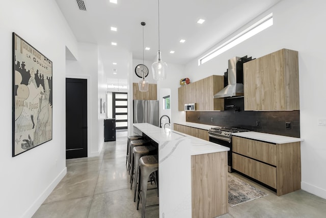 188 Yale Dr, Lake Worth Beach, FL 33460 - kitchen with modern cabinets, visible vents, concrete floors, wall chimney exhaust hood, and appliances with stainless steel finishes