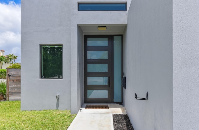 188 Yale Dr, Lake Worth Beach, FL 33460 - doorway to property with stucco siding